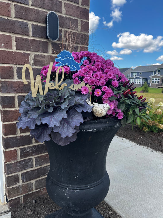 Hand painted flower pot signs.